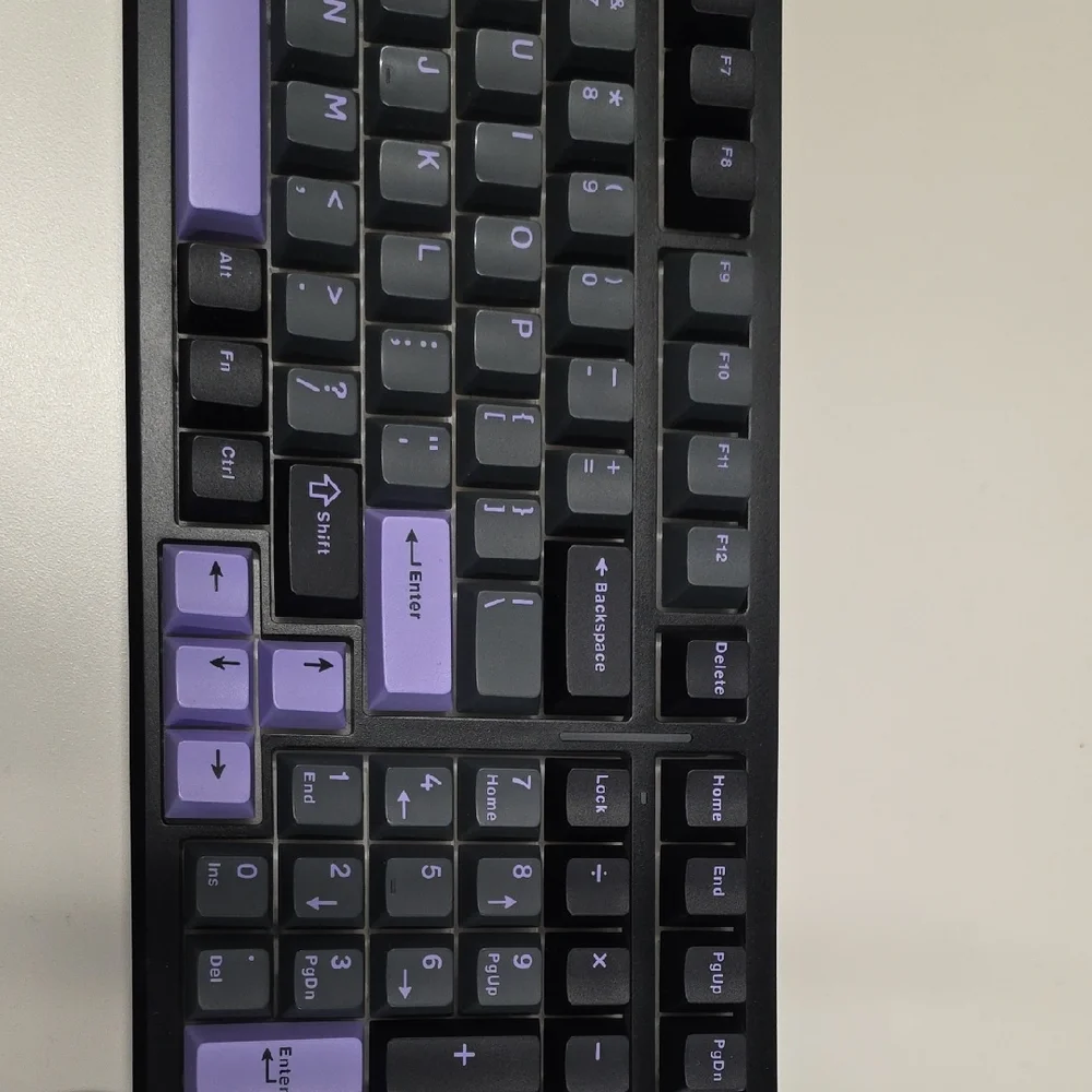 Mechanical Keyboard with Purple and Black Keys